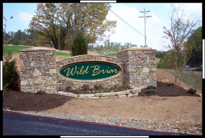 Stone entrance sign reading "Wild Briar.